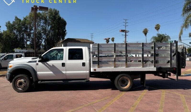 
								2012 Ford F-550 XL 12′ cama de estacas con puerta trasera (1600 LB) full									