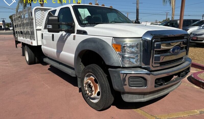 
								2012 Ford F-550 XL 12′ cama de estacas con puerta trasera (1600 LB) full									