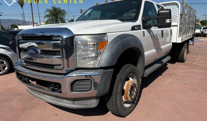 
								2012 Ford F-550 XL 12′ cama de estacas con puerta trasera (1600 LB) full									